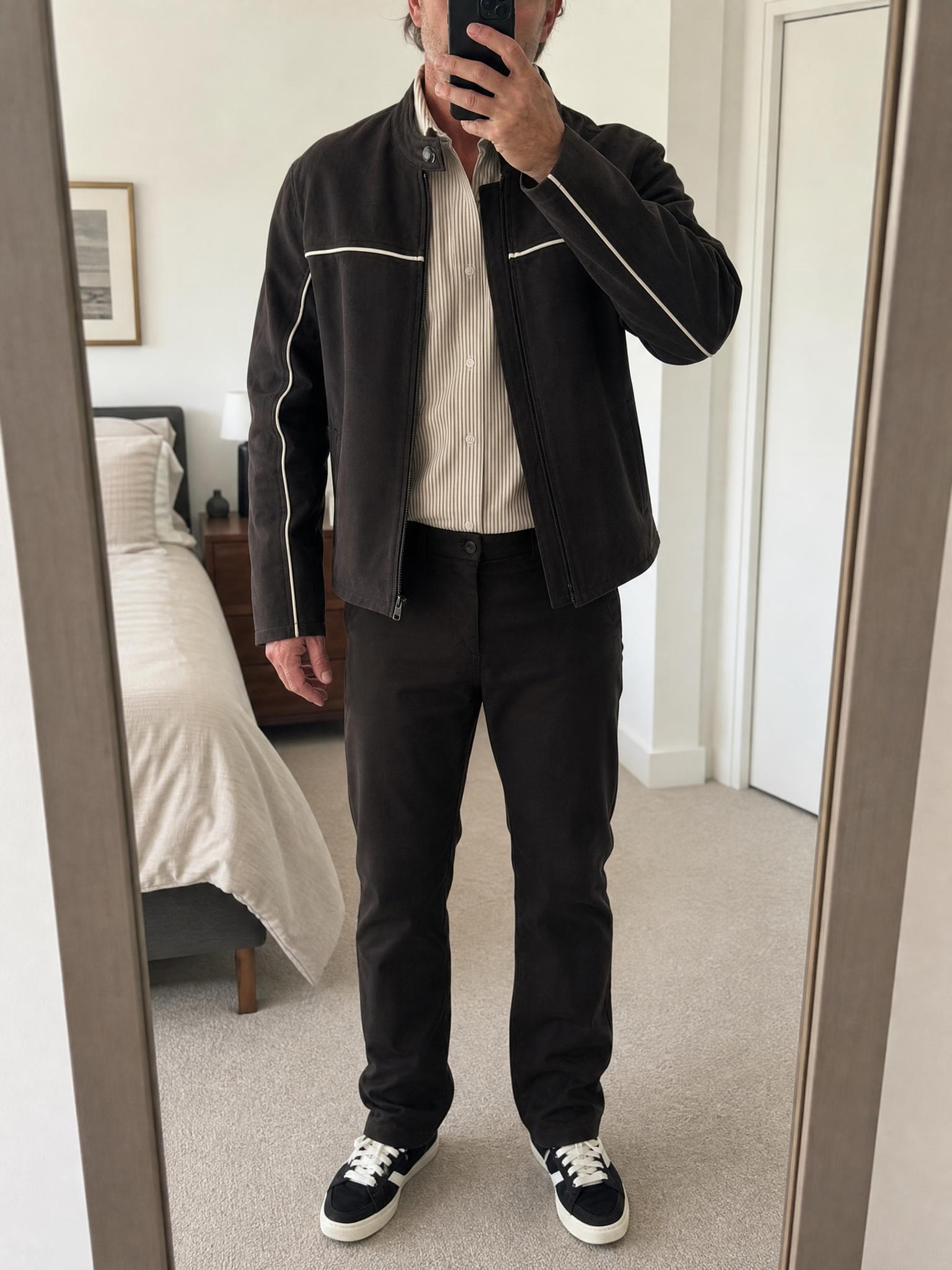 Black tailored slim-fit trousers with red pocket stitching