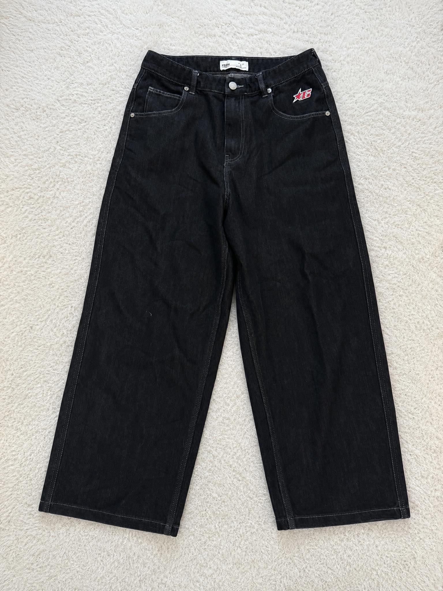 Black straight-leg jeans with embroidered XC detail - good condition