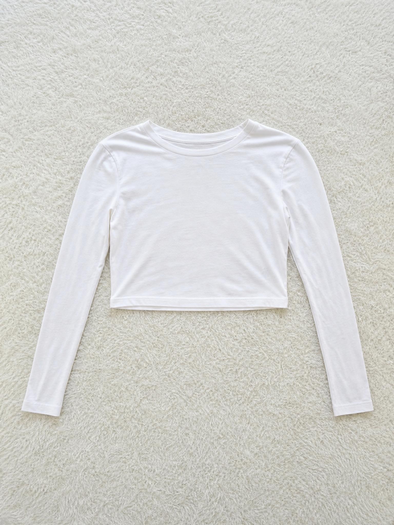 White long-sleeve cropped fitted top