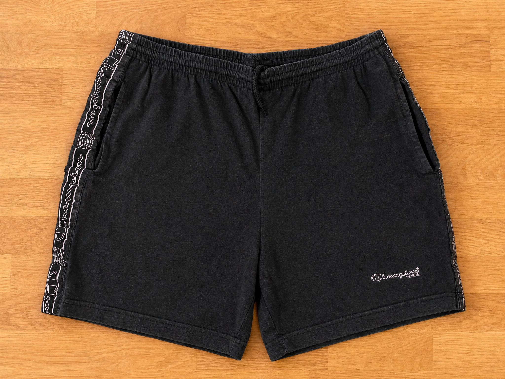 Champion black sports shorts with logo side stripes – very good