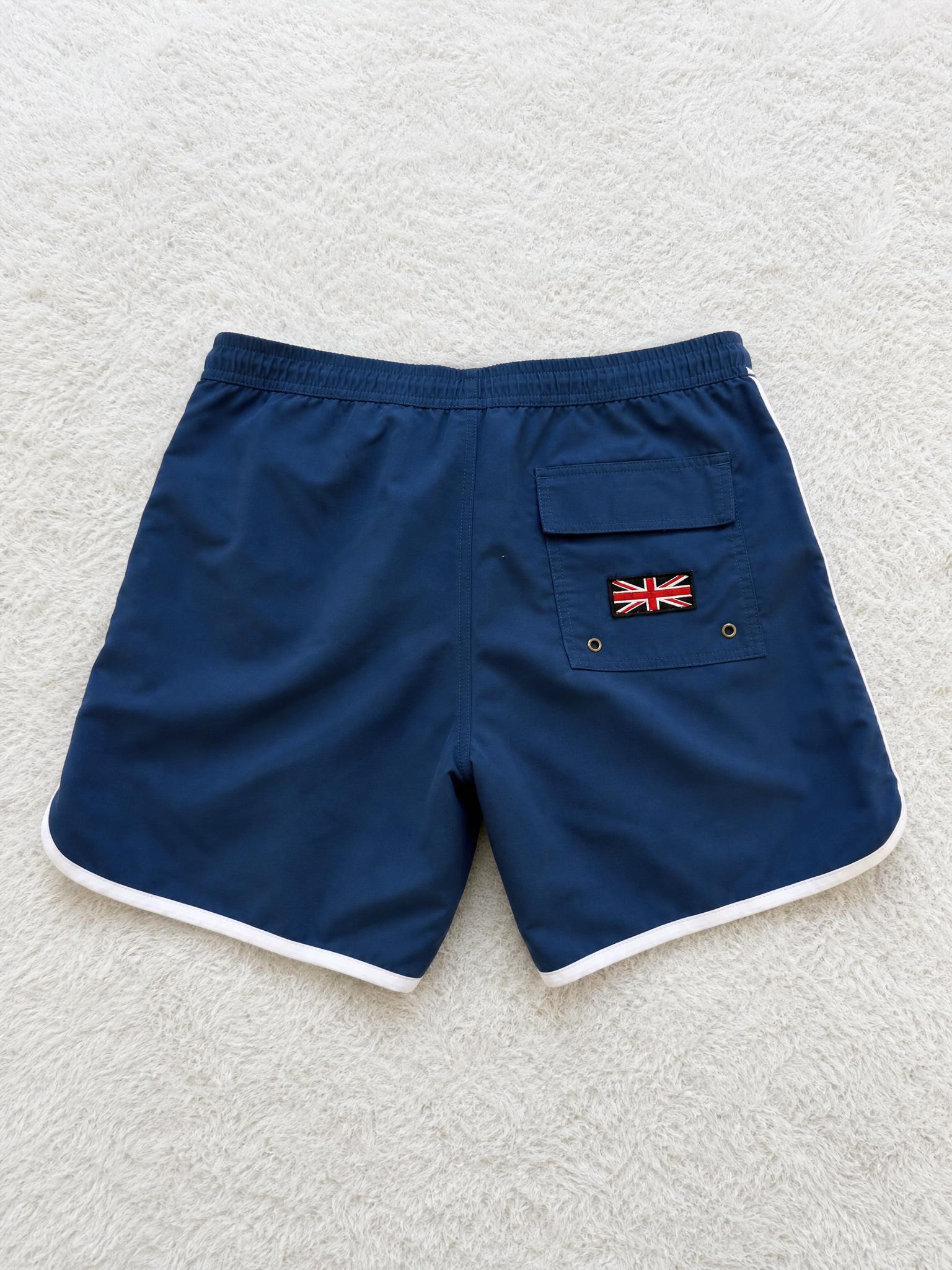 Navy swim shorts with Union Jack patch and cargo pocket