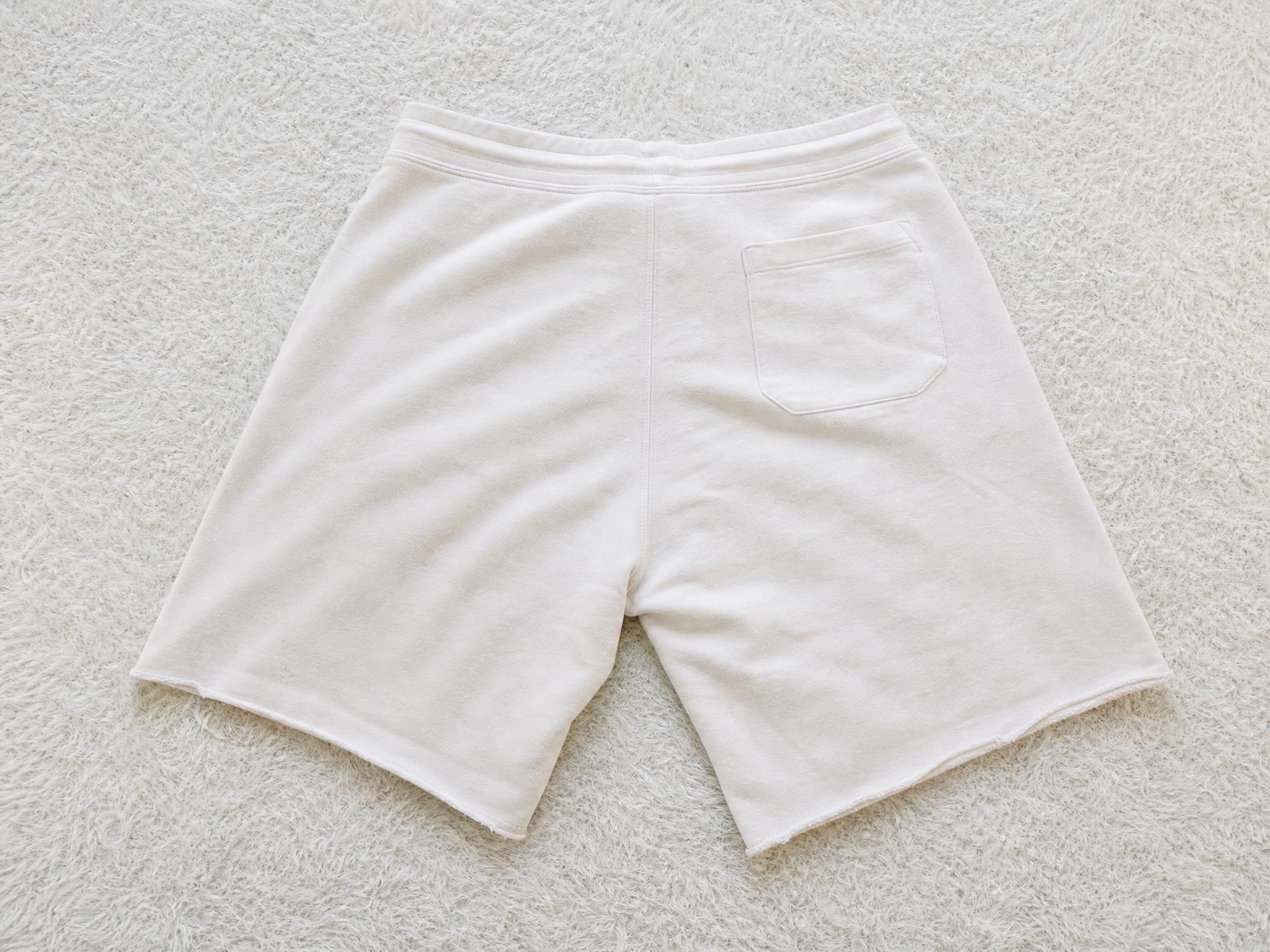 White casual shorts with elasticated waist and pocket