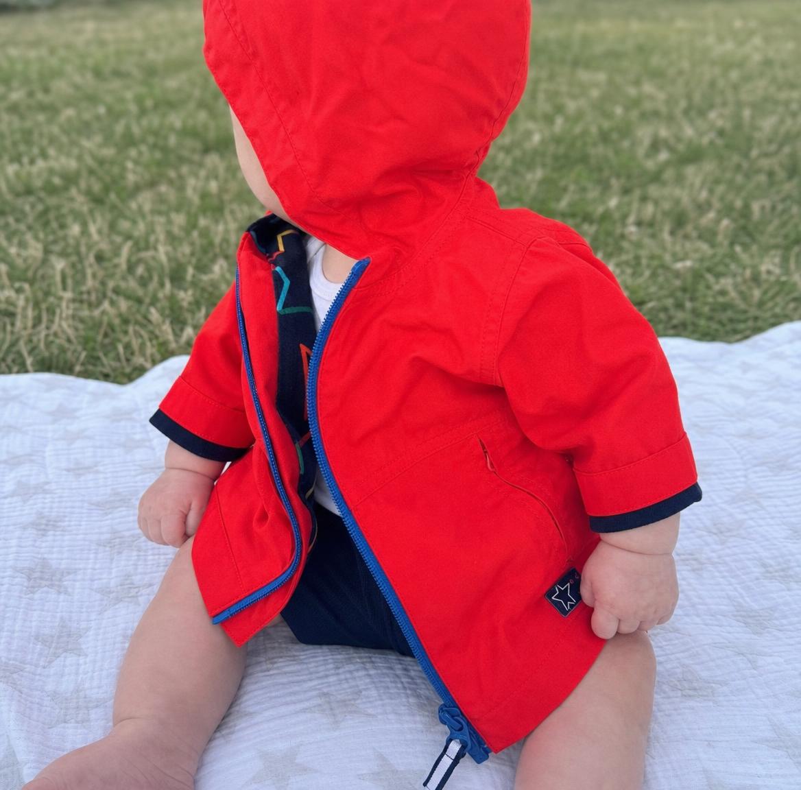 Kids red hooded jacket with colourful lining