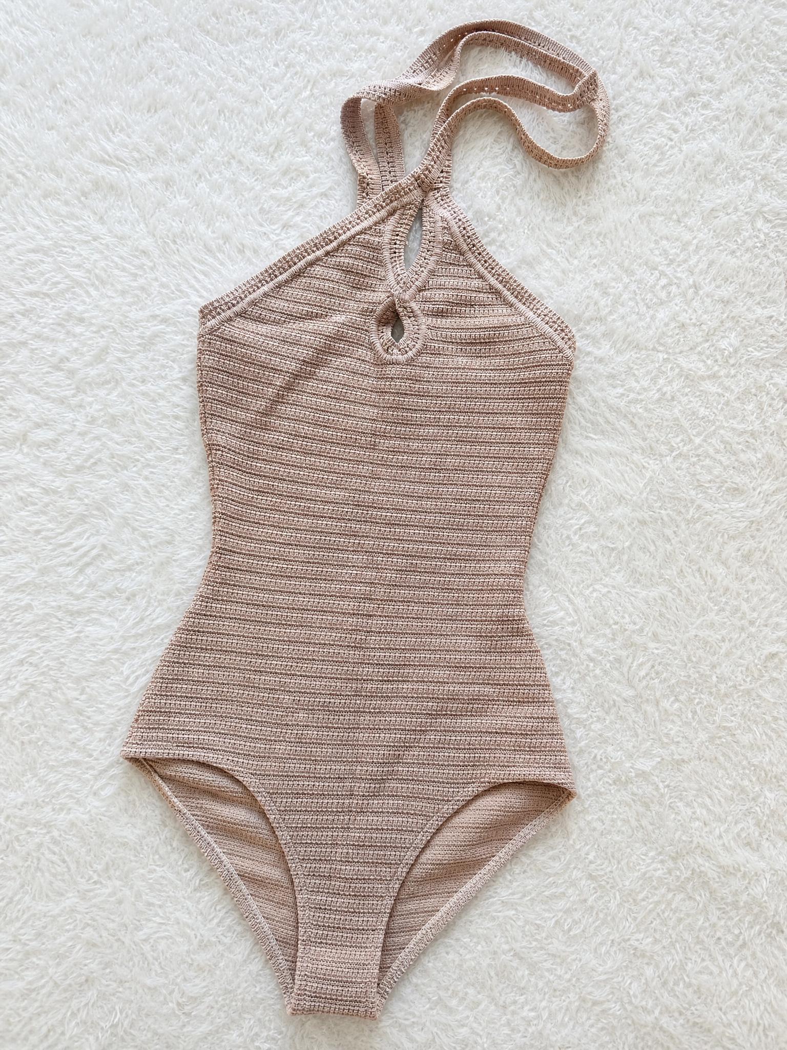 Ribbed beige halter one-piece swimsuit with cut-out