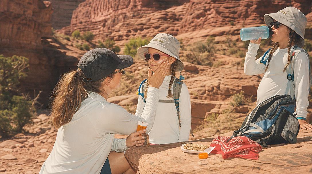 Child wearing long sleeve hiking shirt protecting from sun and bugs