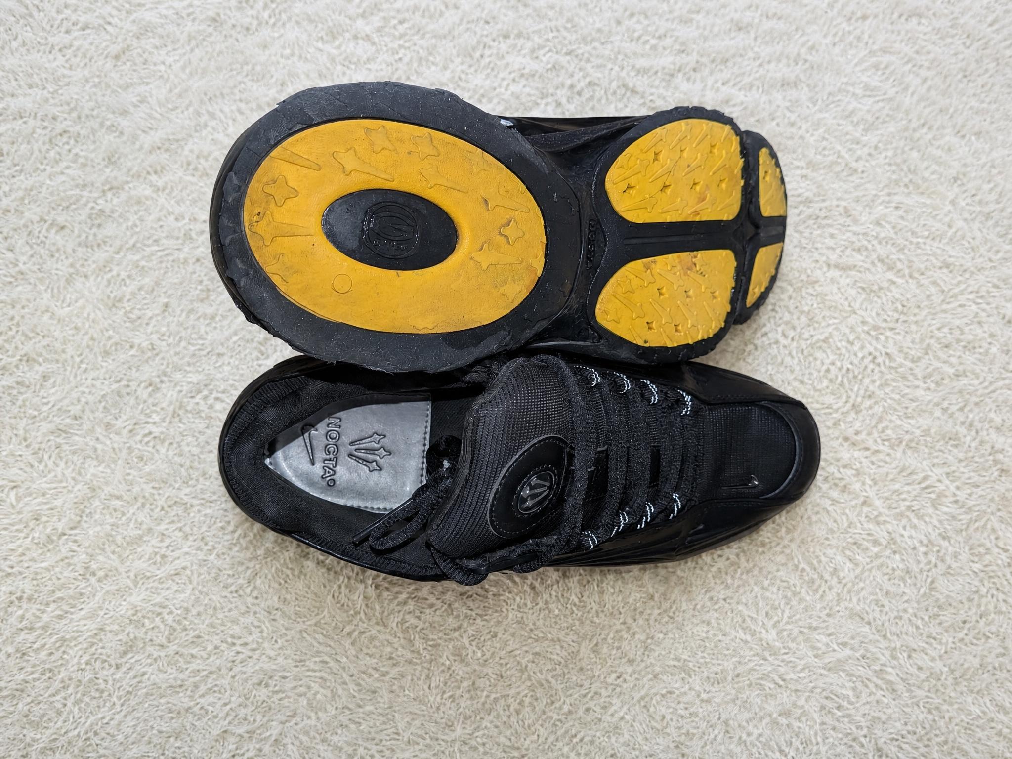 Black skate trainers with yellow grip sole – well worn