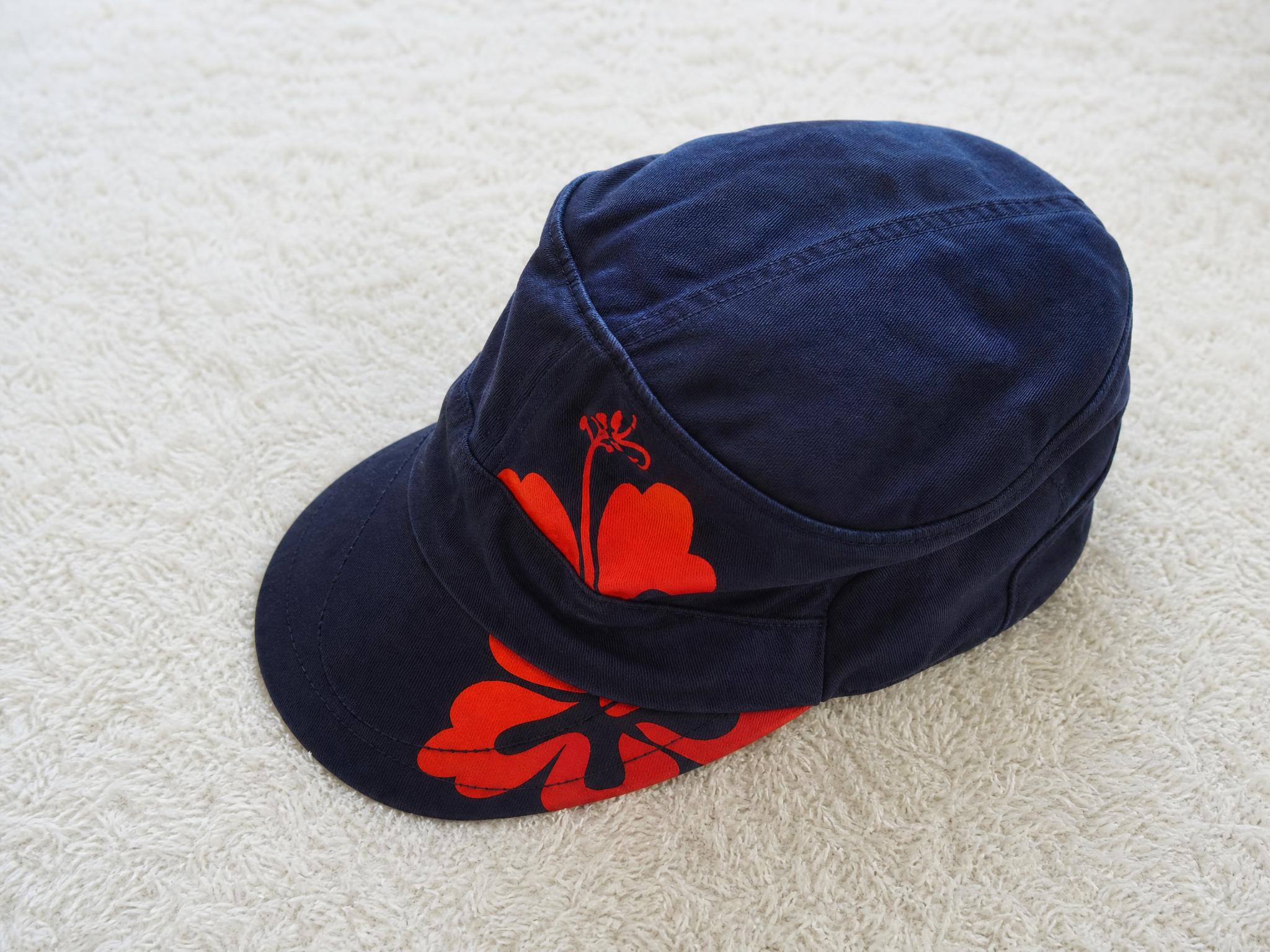 Navy Blue Floral Cap with Orange Print – Very Good Condition