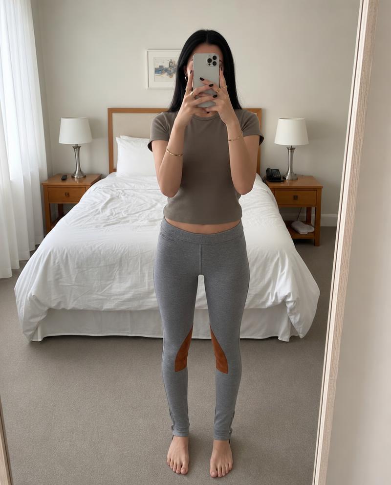 Grey equestrian riding leggings with brown knee patches