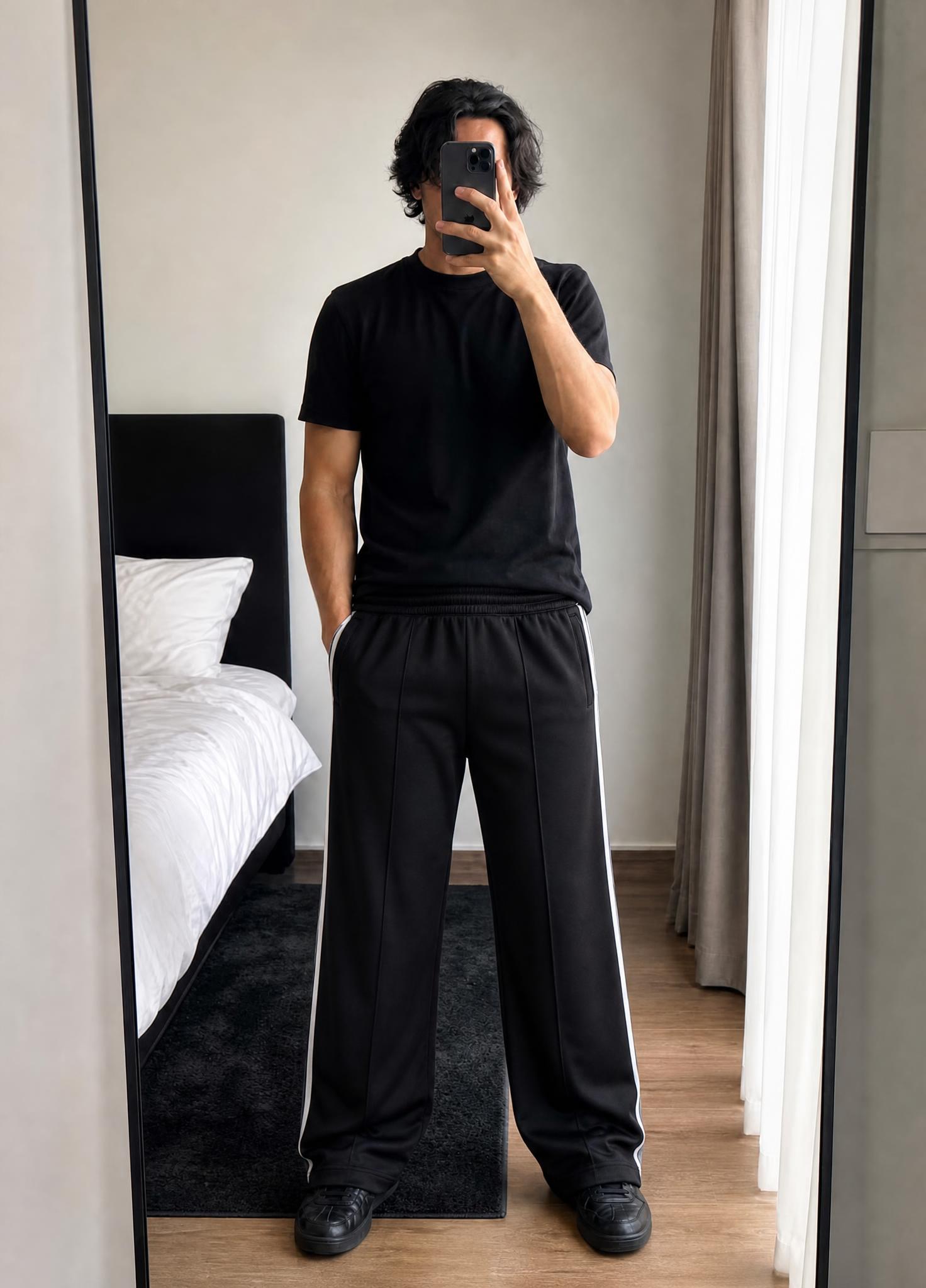 Black wide-leg sports trousers with white side stripes