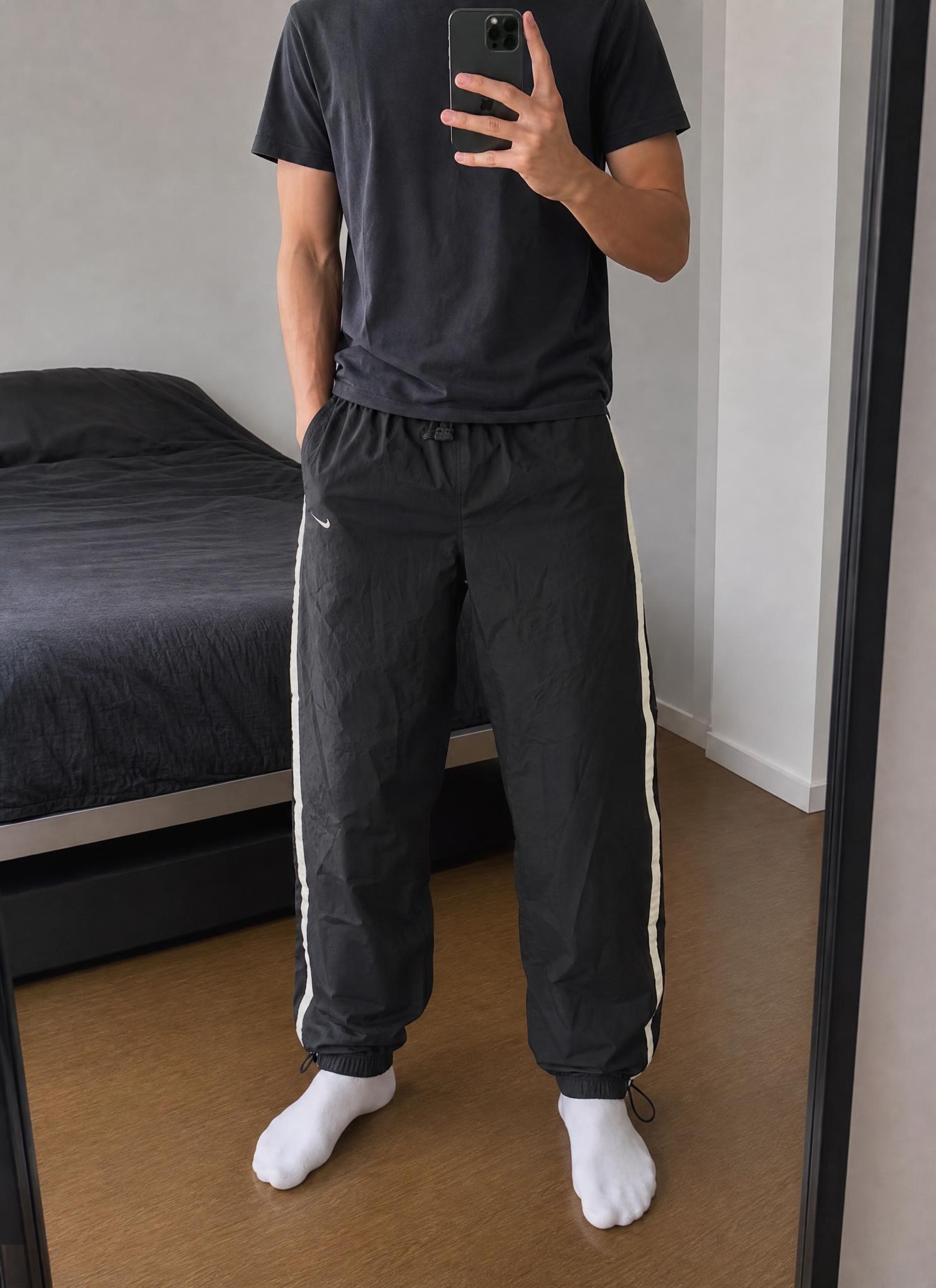 Nike black track pants with white side stripes