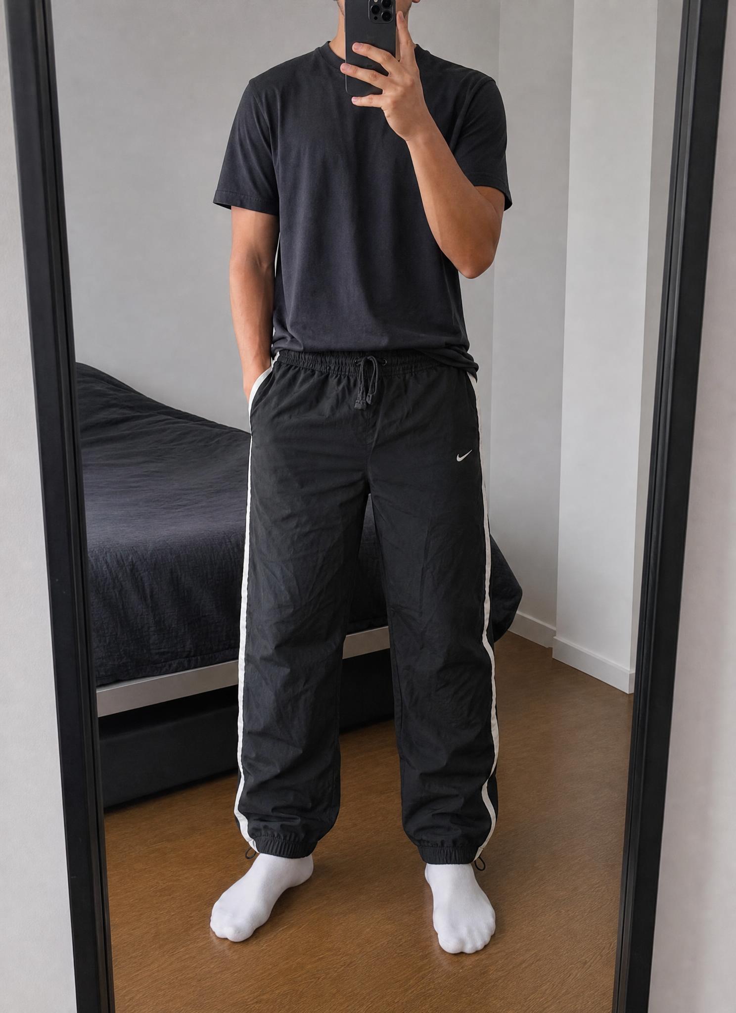 Nike black track pants with white side stripes