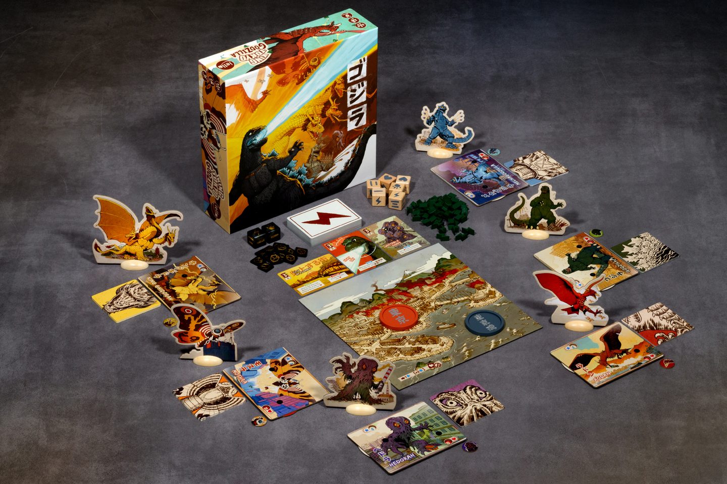 Complete King of Tokyo Godzilla game setup with board, cards and monster standees