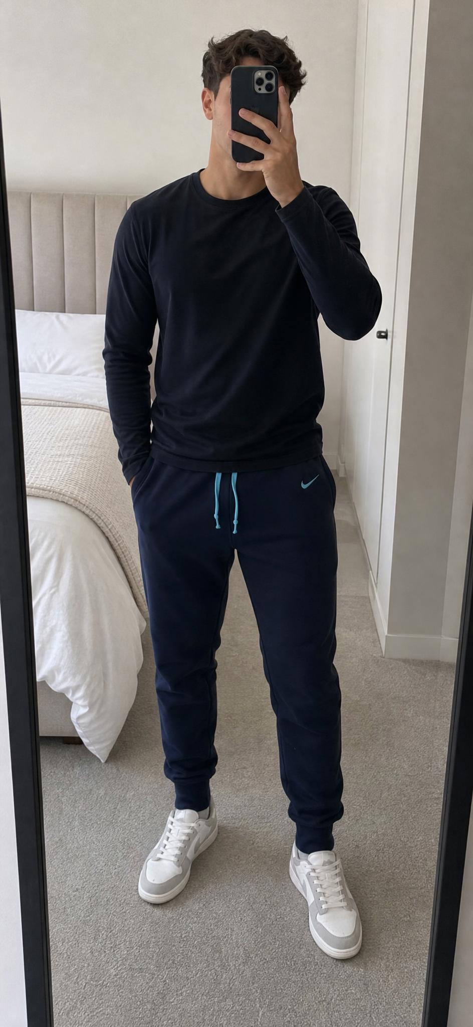 Nike black tapered joggers with drawstring and cuffed ankles