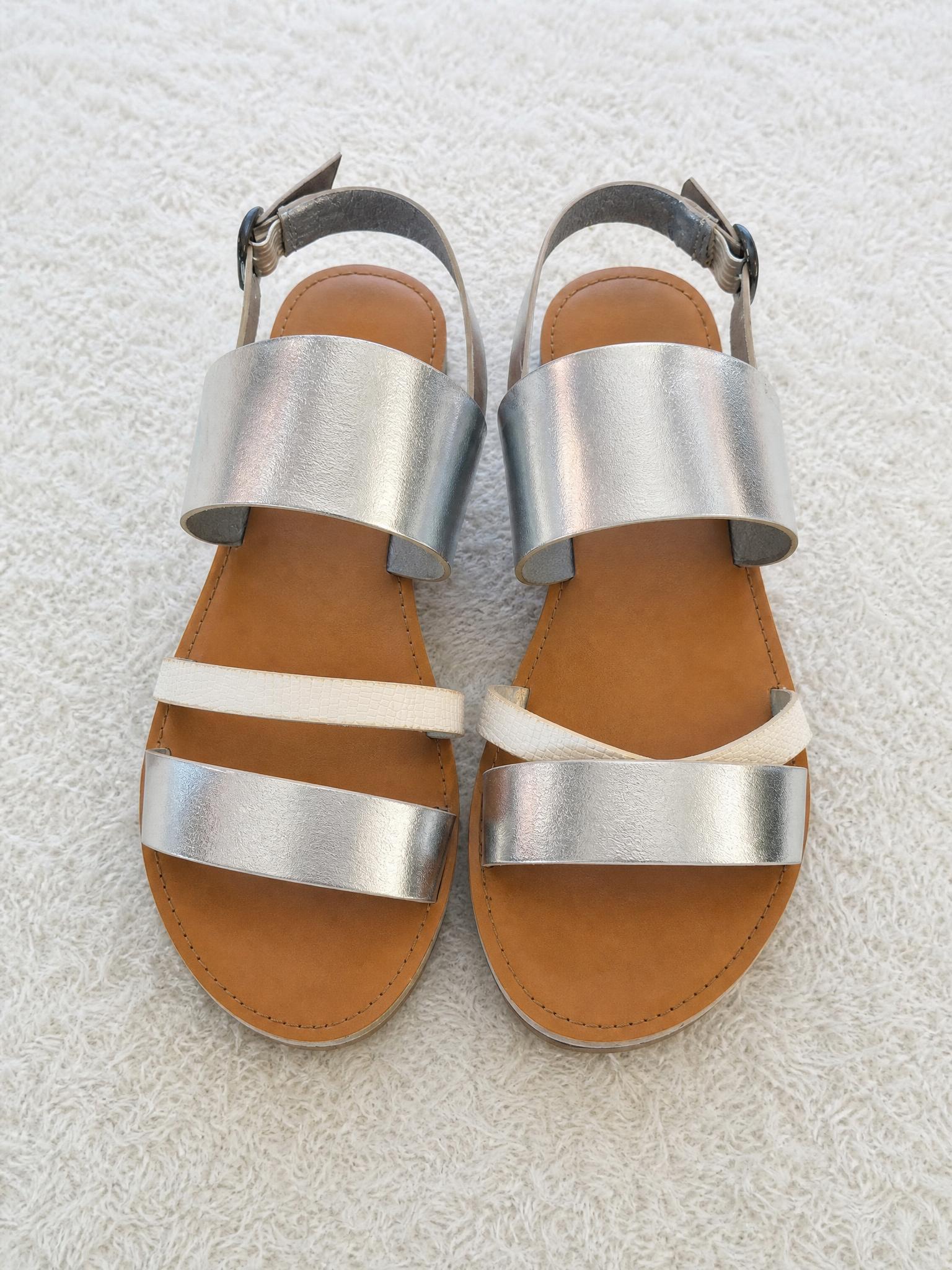 Metallic blue strappy flat sandals with buckle fastening