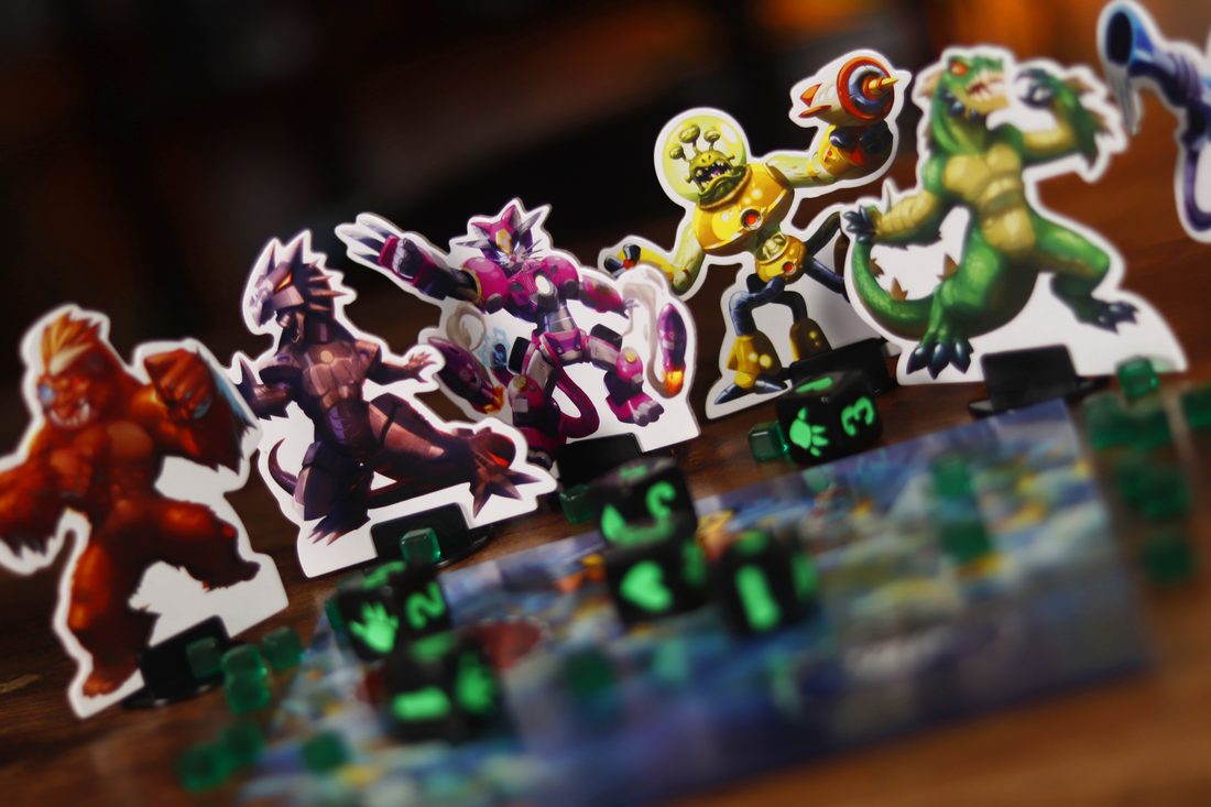 The six cardboard figures lined up
