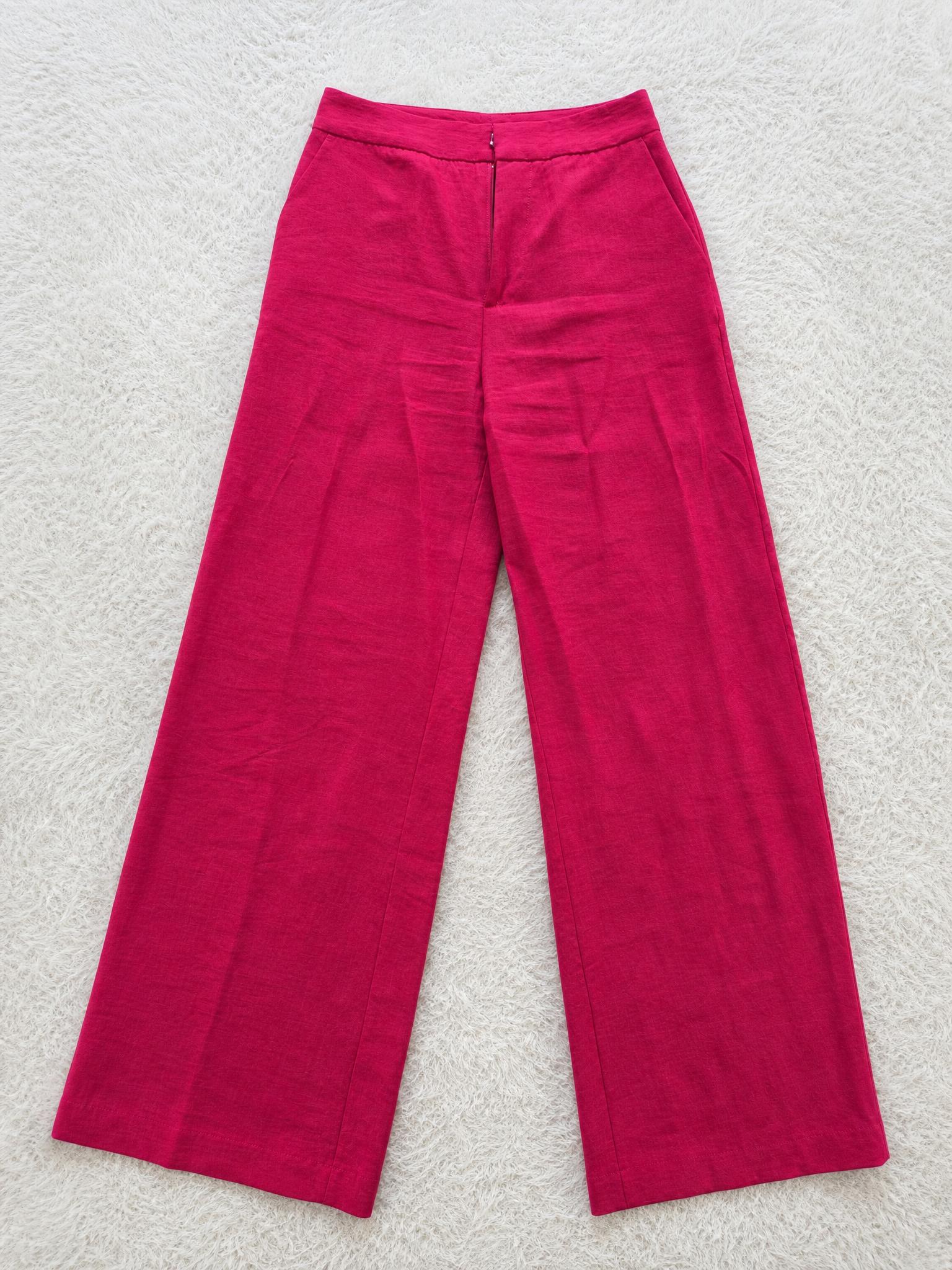 Fuchsia pink wide-leg trousers with crushed texture