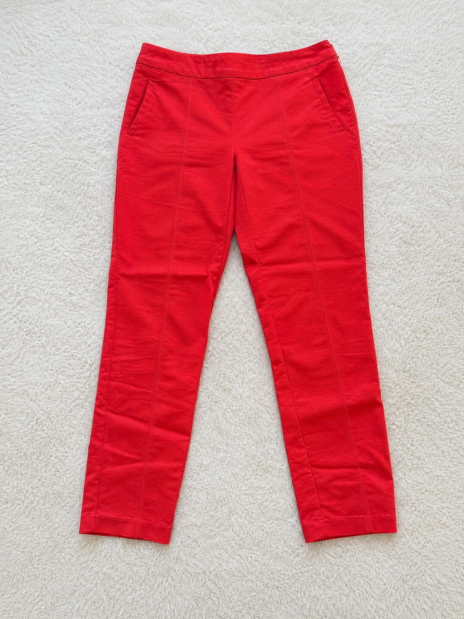Red high-waisted straight-leg trousers with side pockets