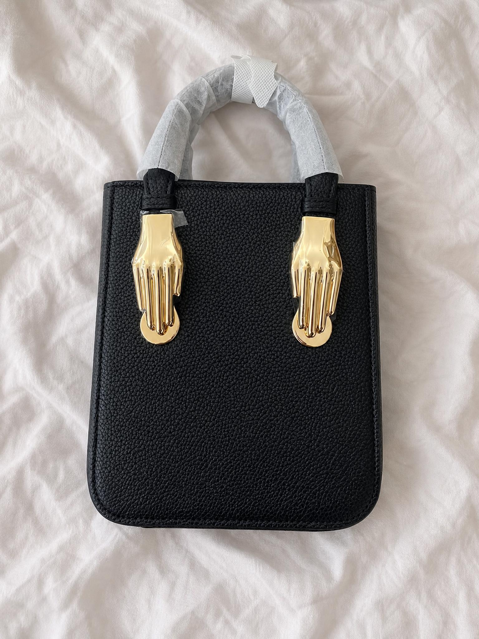 Black Structured Handbag with Gold Hand-Shaped Hardware Like New