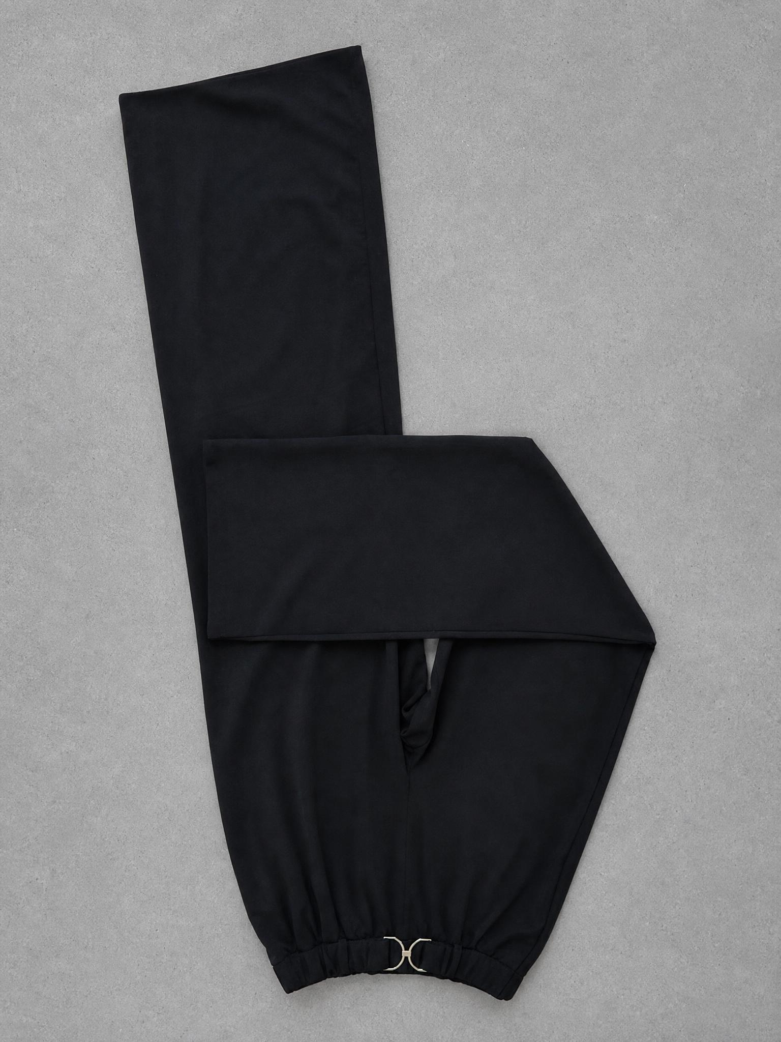 Black high-waisted wide-leg trousers with gold clasp
