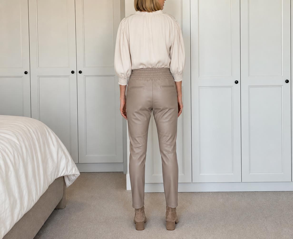 Beige elasticated waist trousers with back zip pocket