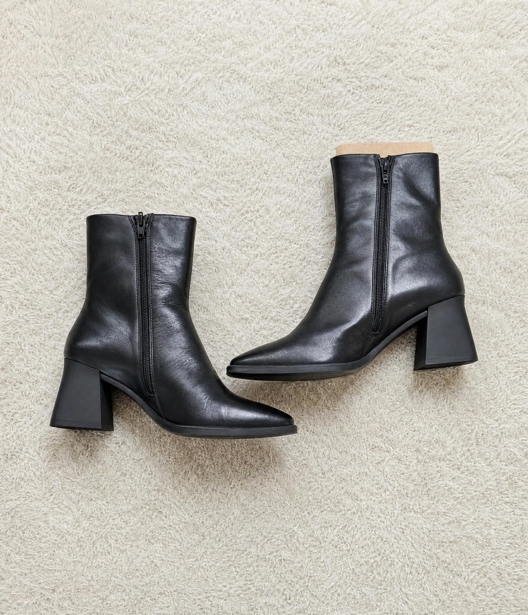 Black pointed-toe heeled ankle boots with side zip