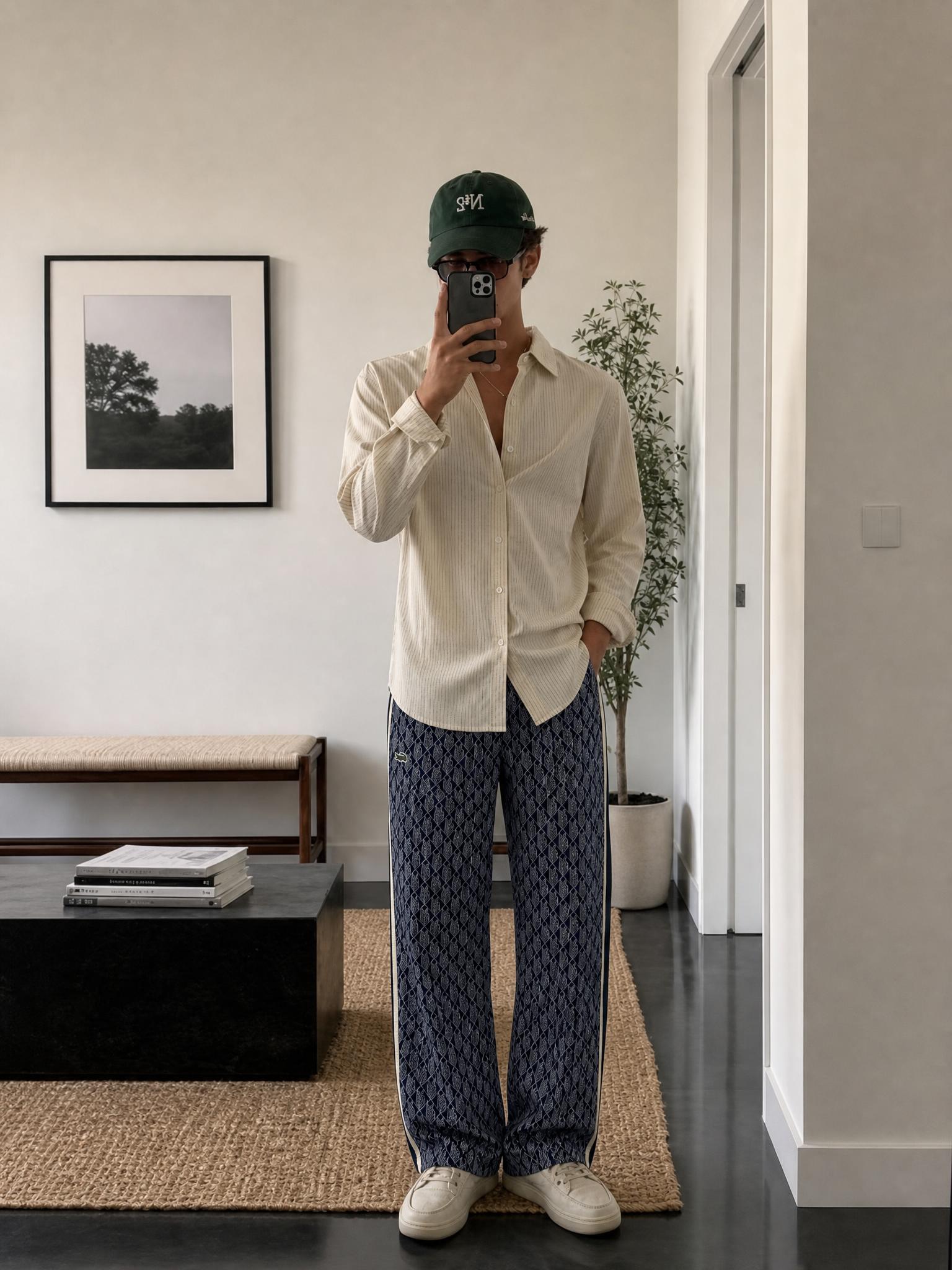 Lacoste navy geometric print trousers with side stripes
